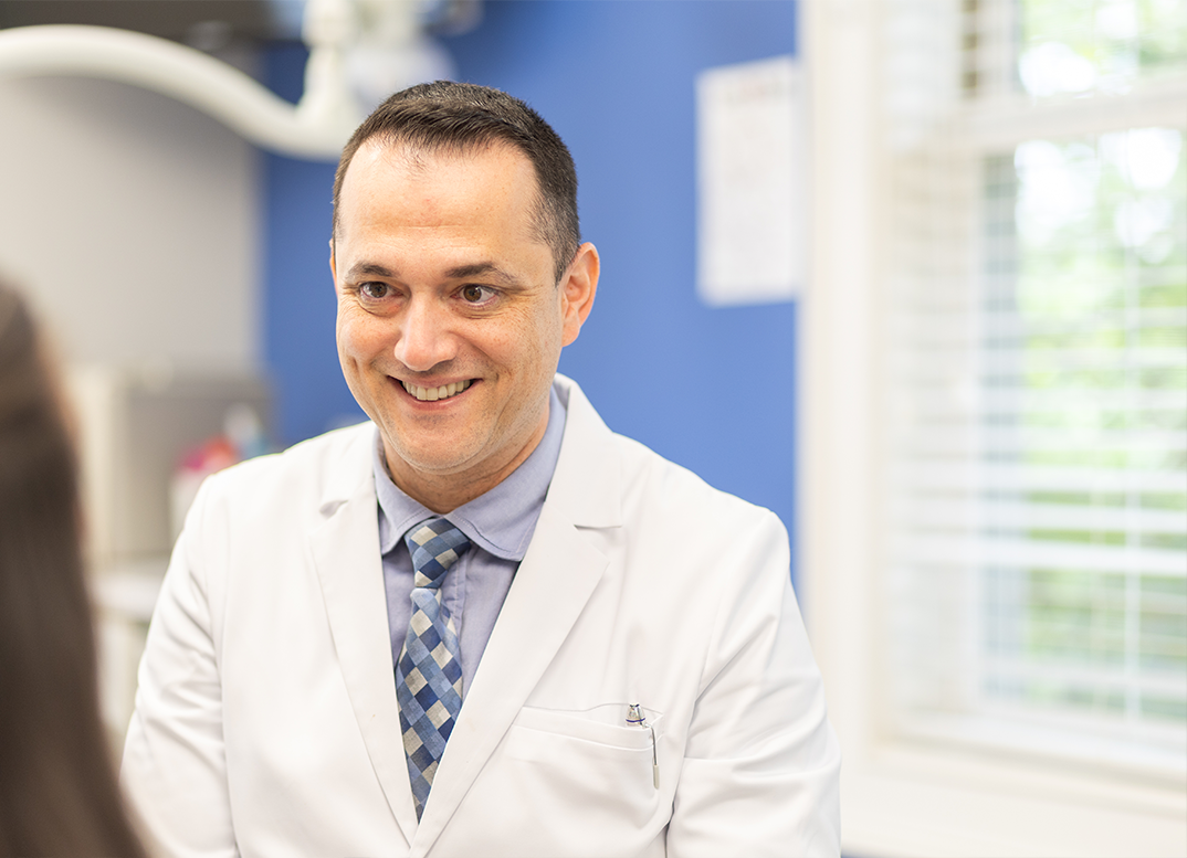 Orthodontist smiling at a patient