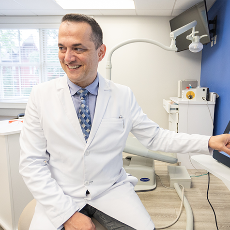 Orthodontist smiling at a patient