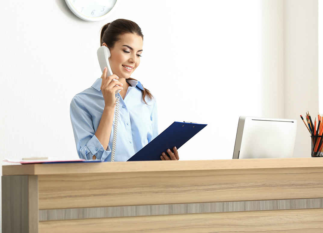 Woman talking on the phone to request an orthodontic appointment in New England