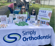 Simply Orthodontics table at an outdoor event